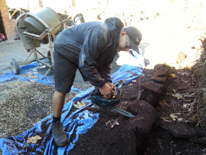 Willie at work on a ponga carving.
